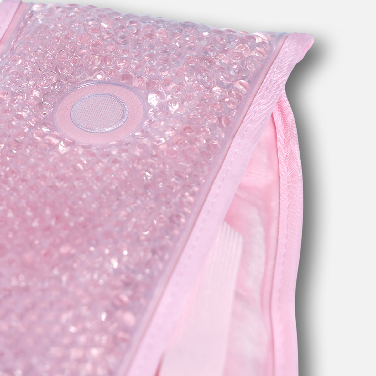 Close-up of pink gel beads in period heat pack