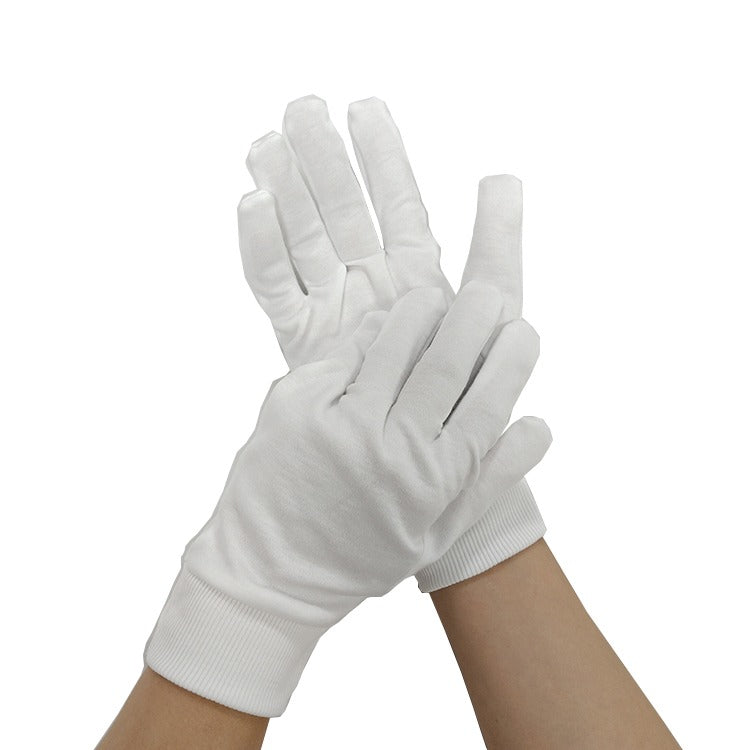 Hands wearing white cotton gloves