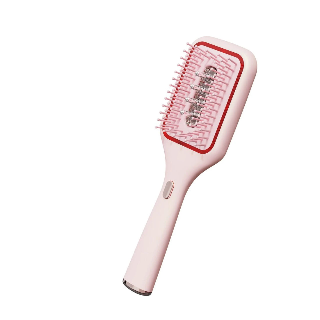 Pink oil-dispensing brush with oil reservoir fitted